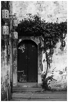 Wooden door with lanterns and flowers. Hongcun Village, Anhui, China ( black and white)