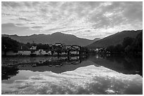 Village and clouds reflected in South Lake. Hongcun Village, Anhui, China ( black and white)
