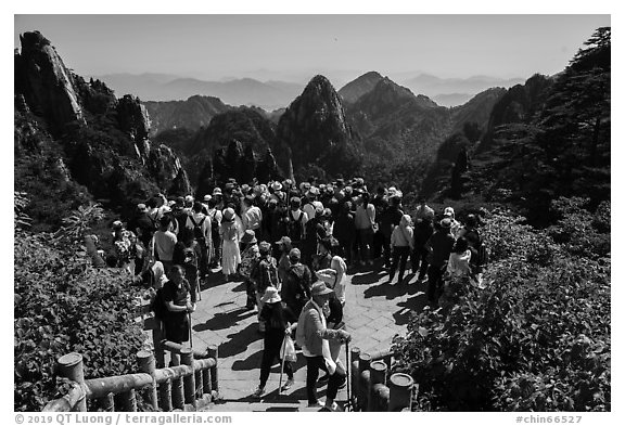 Tourists at overlook. Huangshan Mountain, China (black and white)