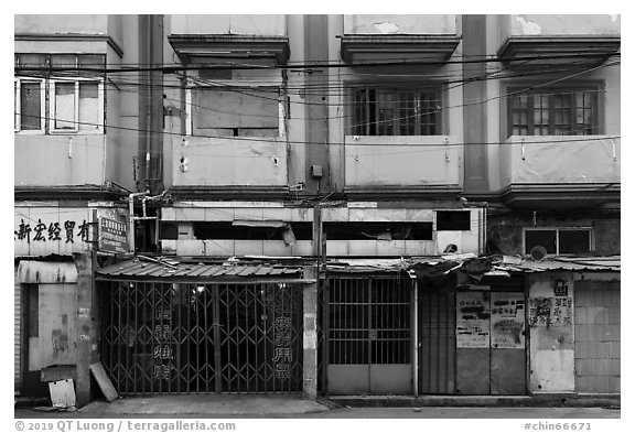 Dilapidated buildings slated for demolition. Shanghai, China (black and white)