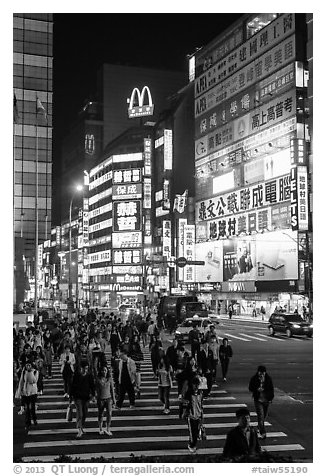 Pedestrian crossing by night and neon signs. Taipei, Taiwan (black and white)