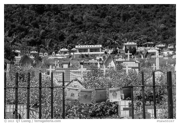 Prayer flags and graves on hillside, Chongde. Taiwan