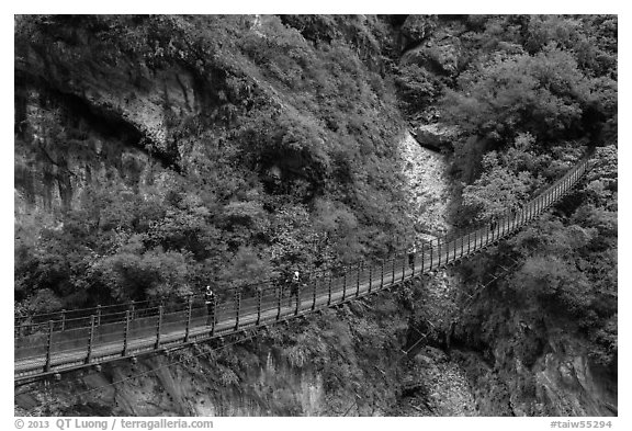 Suspension bridge with hikers. Taroko National Park, Taiwan (black and white)