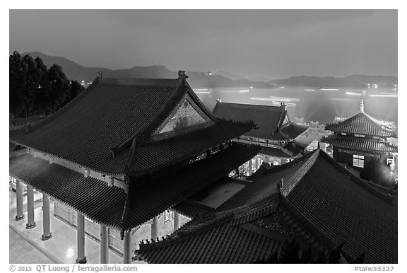 Wen Wu temple at night with light trails from boats. Sun Moon Lake, Taiwan (black and white)