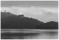 Shabalan Mountain ridge in mist with Syuanzang Temple and Tsen Pagoda. Sun Moon Lake, Taiwan ( black and white)
