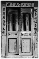 Wooden door with chinese script on red paper. Lukang, Taiwan (black and white)