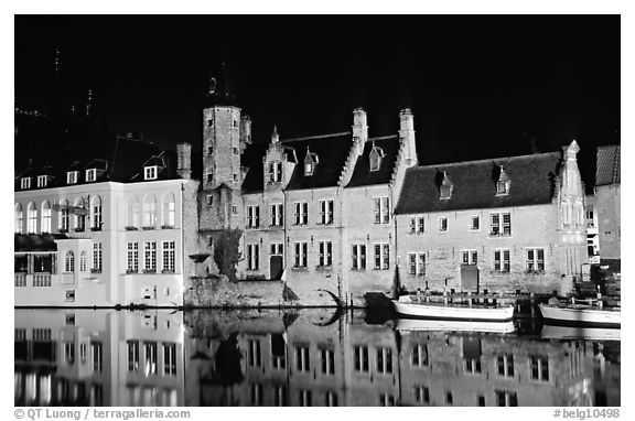 Houses reflected in canal, Rozenhoedkaai, night. Bruges, Belgium (black and white)