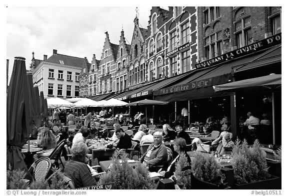 People in restaurants on the Markt. Bruges, Belgium (black and white)