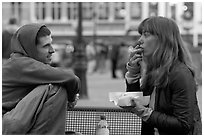 Young woman eating fries, Markt. Bruges, Belgium (black and white)