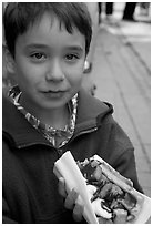 Boy eating a Belgian waffle. Brussels, Belgium ( black and white)