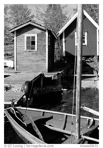 Boat and cabins. Gotaland, Sweden (black and white)