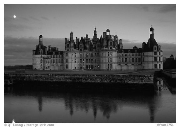 Chambord chateau at dusk with moonrise. Loire Valley, France (black and white)