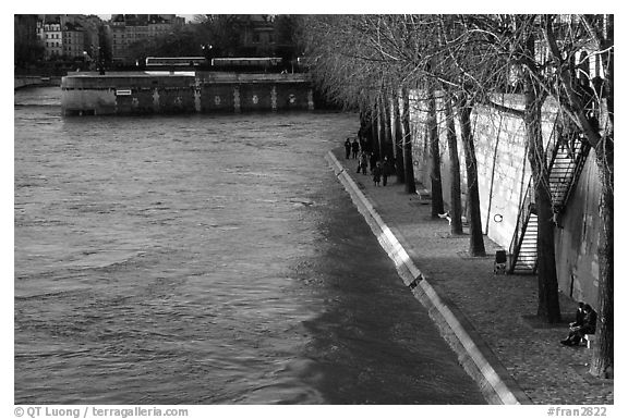 Walking on the banks of the Seine on the Saint-Louis island. Paris, France