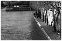 Walking on the banks of the Seine on the Saint-Louis island. Paris, France (black and white)