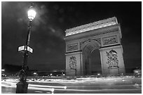 Arc de Triomphe illuminated at night. Paris, France (black and white)