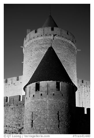 Towers with witch hat roofs by night. Carcassonne, France (black and white)
