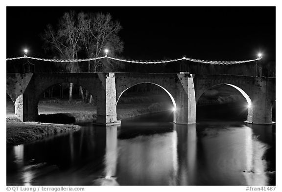 Pont Vieux illuminated by night with Christmas lights. Carcassonne, France (black and white)
