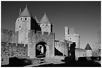 Main entrance of fortified city and drawbridge. Carcassonne, France ( black and white)