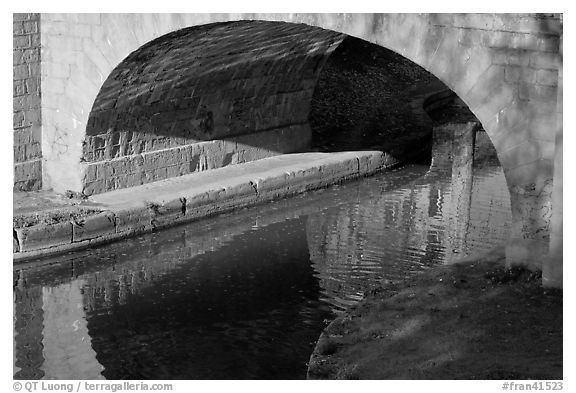 Stone bridge across Canal du Midi. Carcassonne, France (black and white)