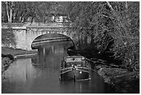 Tranquil scene with barge, bridge, and trees, Canal du Midi. Carcassonne, France ( black and white)