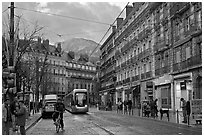 Bicyclist and tramway next to Victor Hugo place. Grenoble, France ( black and white)