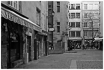 Square with restaurant offering the local specialty bouchon lyonnais. Lyon, France ( black and white)