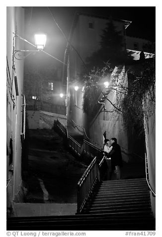 Couple embrassing romantically on stairs to Fourviere Hill. Lyon, France (black and white)