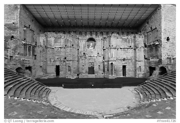 Tiered seats, orchestra, stage, and stage roof, Roman theater. Provence, France (black and white)