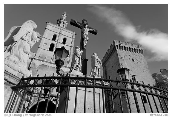 Crucifix in front of Notre-Dame-des-Doms Cathedral. Avignon, Provence, France (black and white)