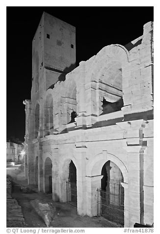 Arenes Roman amphitheater with defensive tower at night. Arles, Provence, France (black and white)
