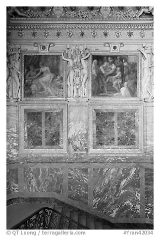 Wall decor in staircase inside Chateau de Fontainebleau. France (black and white)