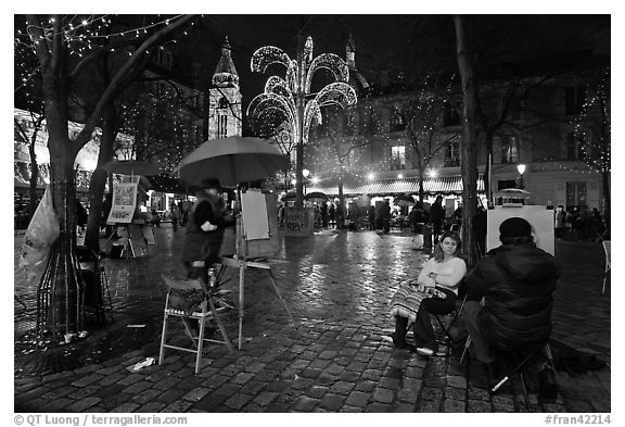 Place du Tertre by night with Christmas lights, Montmartre. Paris, France (black and white)