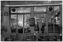 Popular cafe restaurant by night. Paris, France (black and white)