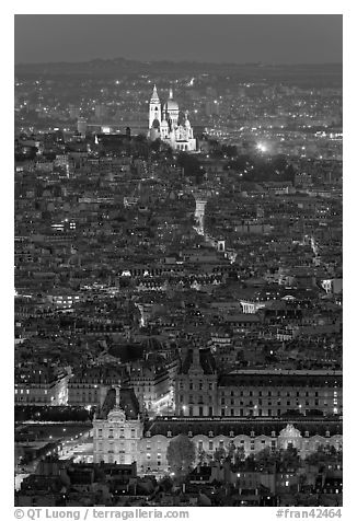 Aerial view with Louvre and Montmartre at night, Montmartre. Paris, France
