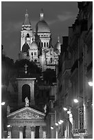 Church of Notre-Dame-de-Lorette with the Basilica of the Sacre Coeur behind at night. Paris, France (black and white)