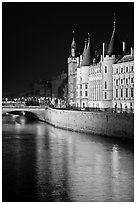 Conciergerie reflected in Seine river at night. Paris, France ( black and white)