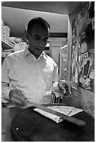 Man preparing a crepe, Montmartre. Paris, France (black and white)