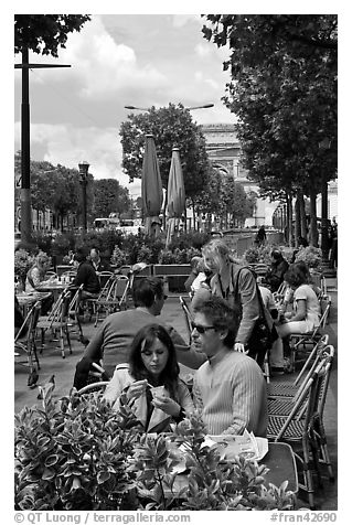 Couple at outdoor cafe on the Champs-Elysees. Paris, France (black and white)