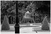 Cortot Fountain in park, place des Vosges. Paris, France (black and white)