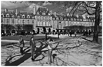Girls playing in park, Place des Vosges. Paris, France (black and white)