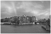 Clearing storm with rainbow above Saint Louis Island. Paris, France ( black and white)
