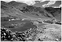 Stone fence, chortens, cultivations, and village, Zanskar, Jammu and Kashmir. India (black and white)