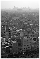 View of Old Delhi from above with high rise skyline in back. New Delhi, India (black and white)