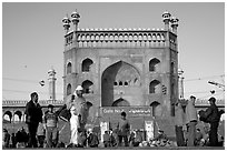 Early morning activity under Jama Masjid East Gate. New Delhi, India (black and white)