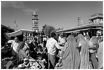 Sadar Market, with women in colorful sari and clock tower. Jodhpur, Rajasthan, India (black and white)