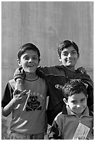 Young boys in front of blue wall. Jodhpur, Rajasthan, India ( black and white)
