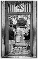 Bell ringing during worship in temple. Varanasi, Uttar Pradesh, India ( black and white)