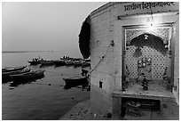 Shrine on the banks of the Ganges River at dawn. Varanasi, Uttar Pradesh, India (black and white)