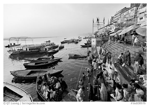 Activity on the steps of Dasaswamedh Ghat, early morning. Varanasi, Uttar Pradesh, India (black and white)