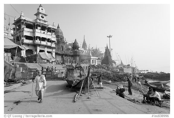 Manikarnika Ghat, with piles of wood used for cremation. Varanasi, Uttar Pradesh, India (black and white)